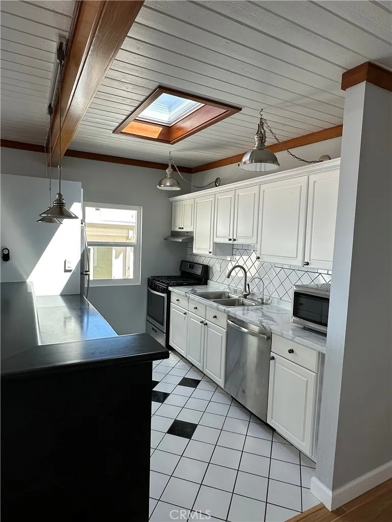 Kitchen with newer appliances, sunroof and views to ocean