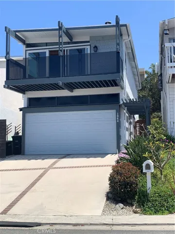 Front view shows large deck off main living area to enjoy your views