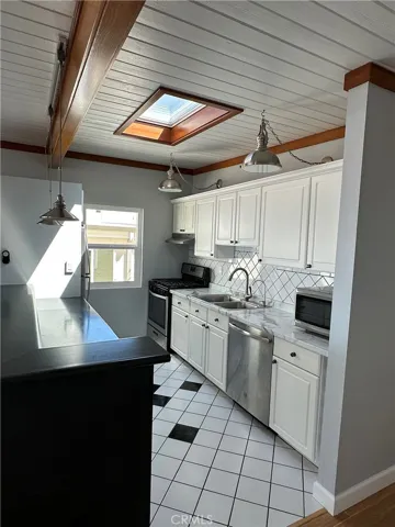 Kitchen with newer appliances, sunroof and views to ocean