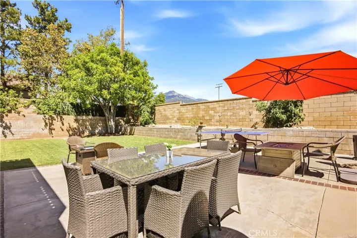 Beautiful backyard with a tree, dining area and gorgeous views