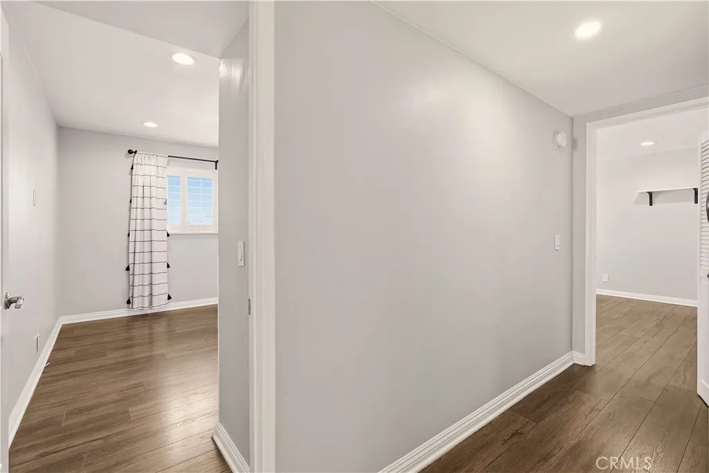 Hallway between primary bedroom and second bedroom Hallway between primary bedroom and second bedroom