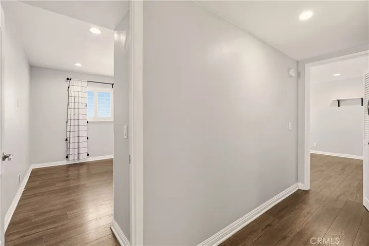 Hallway between primary bedroom and second bedroom