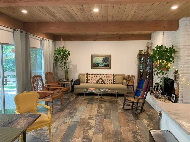Open Floor Plan, Living rooms, Kitchen, Dining area all open to stream and flat back yard, huge covered porch and horse stables. 2 wood burning fireplaces.