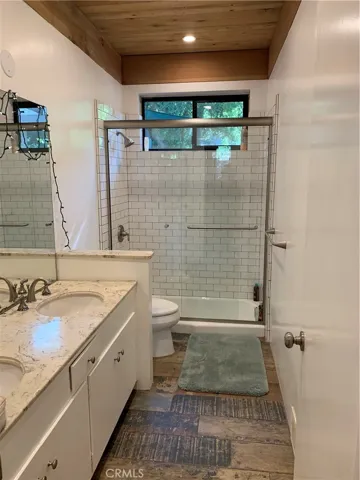 Double sinks, and a Sunken Tub make the second full bathroom unique.