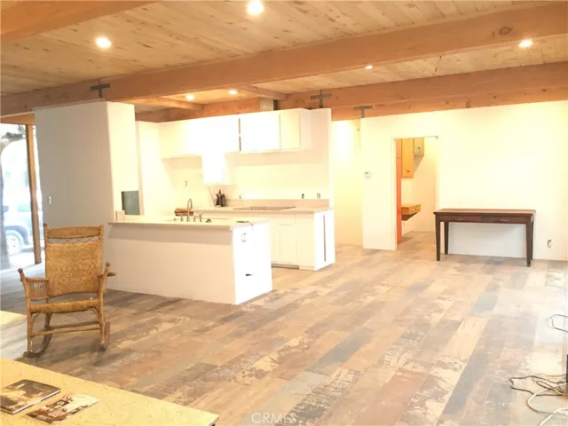 Open Beamed wood Ceilings, Marble Countertops, Custom Lighting, and Rustic European Tile Floors throughout.