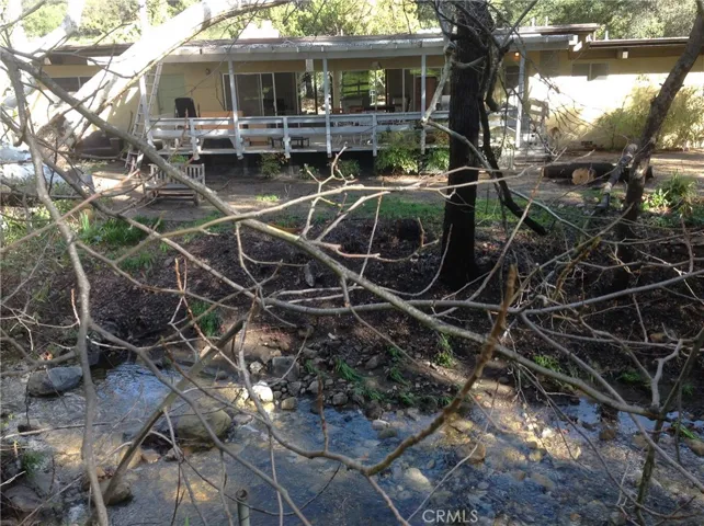 Open Floor Plan Opens to miles of nature and your own Seasonal Stream.