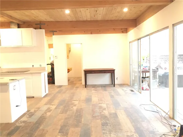 Large open Family room,Diningroom,Kitchen and Livingroom, open to large bright and airy back patio deck that opens to the backyard, the Creek, nature and the Santa Monica Mountains National Recreation Area.