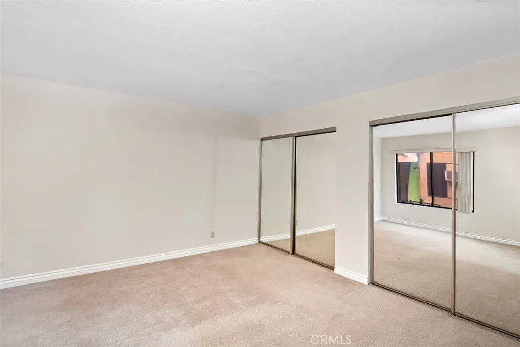 Spacious Bedroom 
with mirrored closets doors