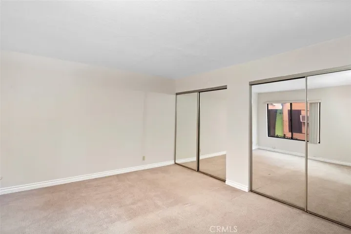 Spacious Bedroom 
with mirrored closets doors