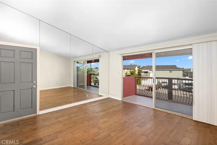 Solid front door, consistent wood flooring