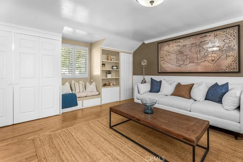Family room reading nook, built in shelving and full size, side-by-side washer & dryer laundry closet