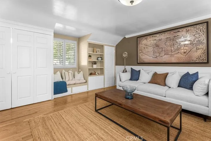Family room reading nook, built in shelving and full size, side-by-side washer & dryer laundry closet