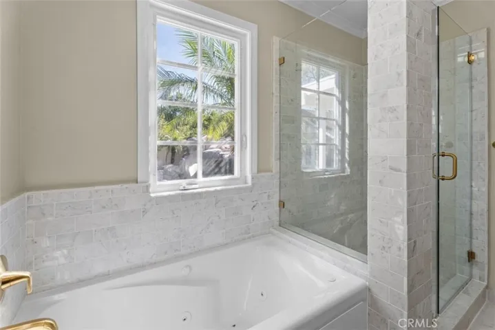 Primary Bathroom with separate shower and  spa tub