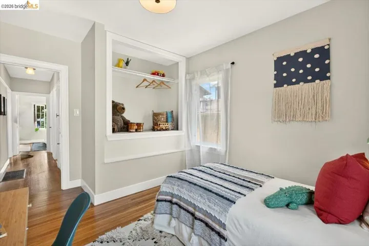 Hardwood flooring, recessed shelving, built-in closet rod, and overhead lighting
