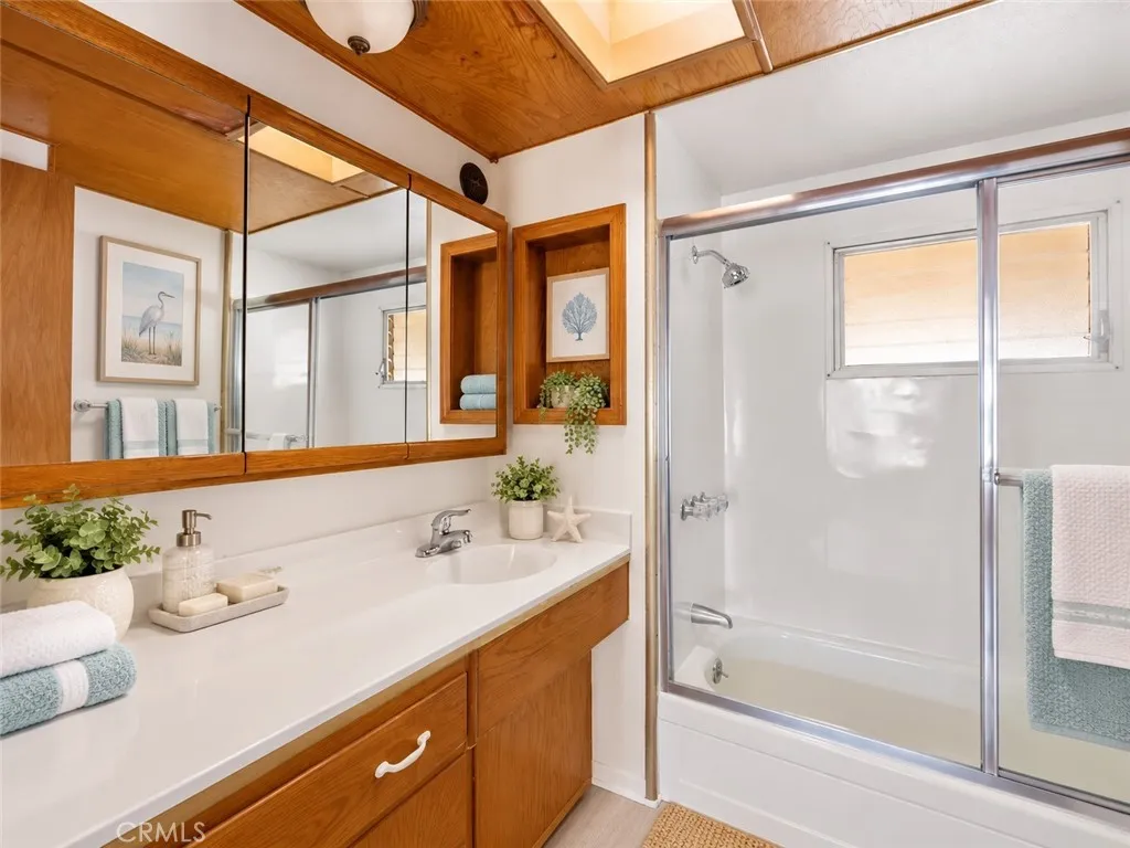 Bathroom with tub and shower/Virtually staged