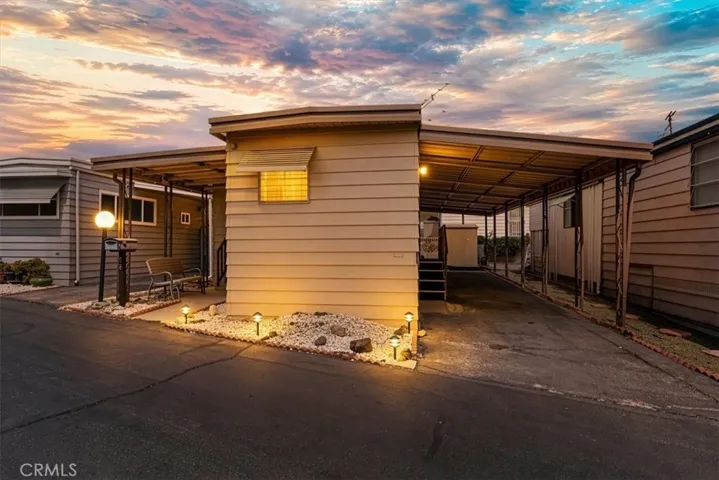 Exterior home with covered carport