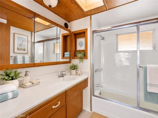 Bathroom with tub and shower/Virtually staged
