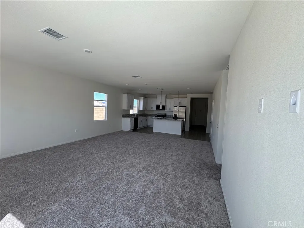 large family room with high ceilings and wired for flat screen TV