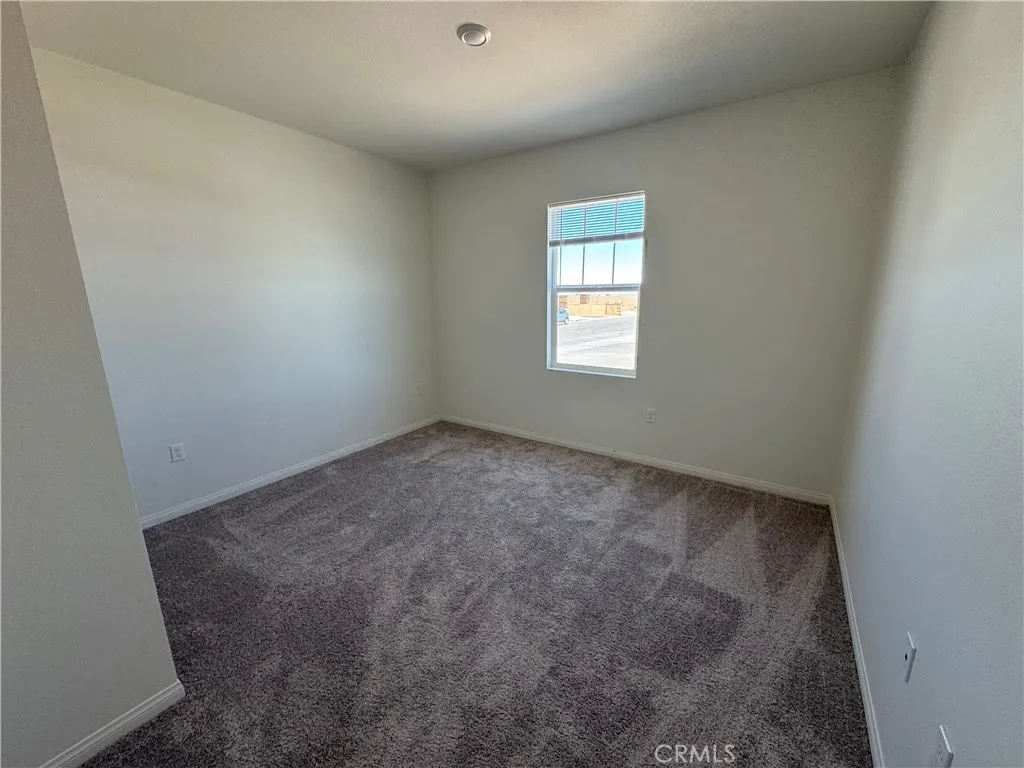 bedroom facing sea ace lane adjacent to bathroom with shower