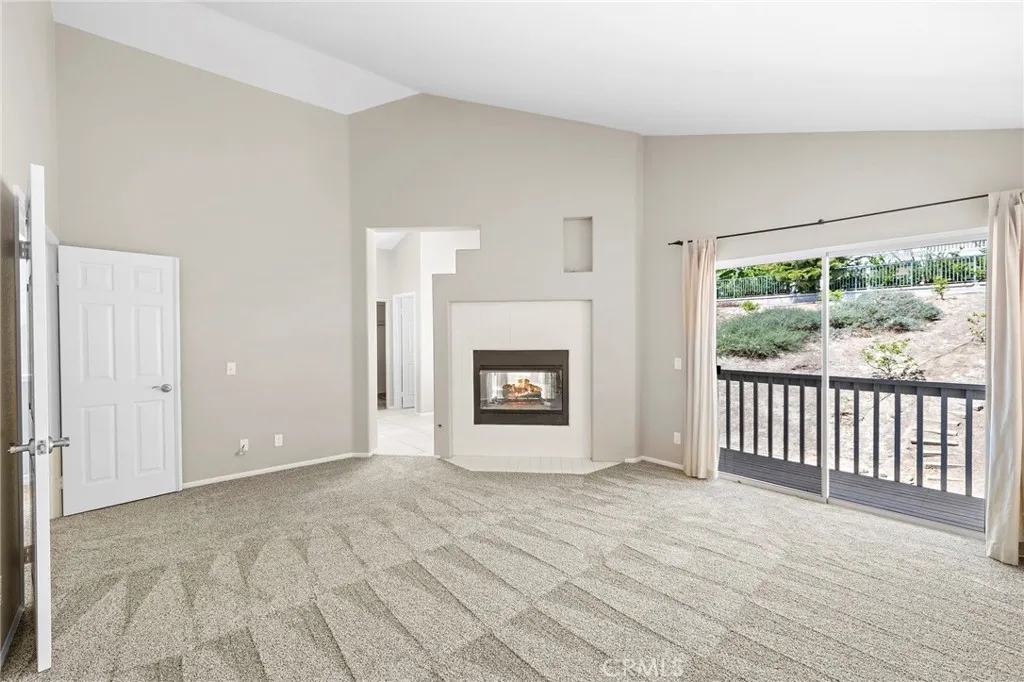 primary bedroom - fireplace & balcony primary bedroom - fireplace & balcony