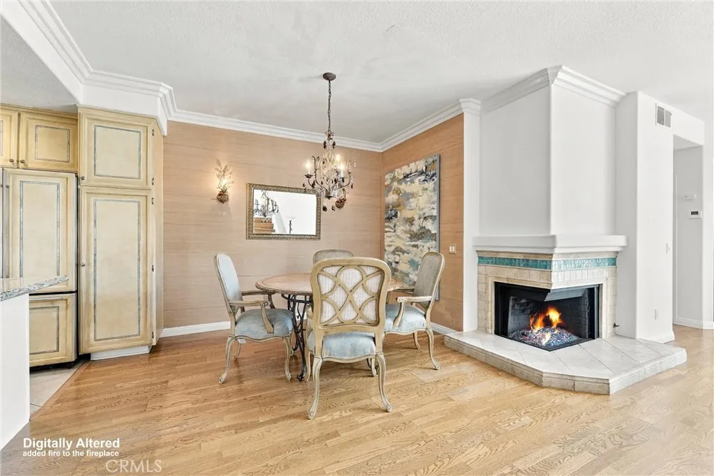 View of Dining area from front entrance, beautiful chandelier. (Fireplace flame digitally added). View of Dining area from front entrance, beautiful chandelier. (Fireplace flame digitally added).
