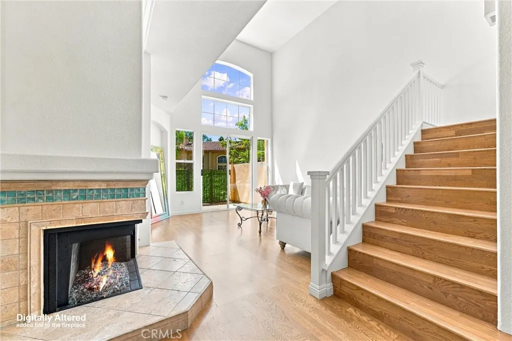 Dining area leading to Living room with beautiful views of the Greenbelt from the Patio. (Fireplace Flame digitally added). Dining area leading to Living room with beautiful views of the Greenbelt from the Patio. (Fireplace Flame digitally added).