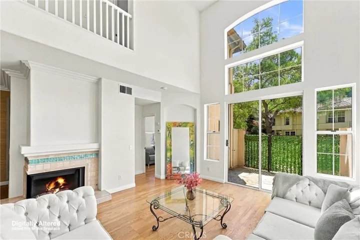 Fresh Paint on walls throughout main rooms. Beautiful hardwood flooring. (Fireplace Flame digitally added).