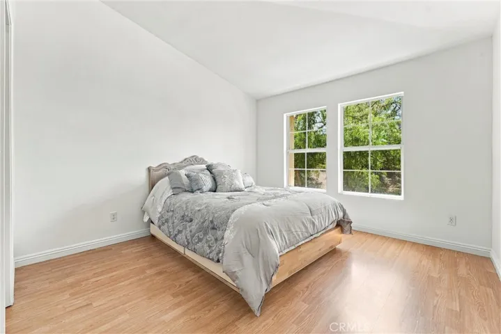 Primary Suite upstairs, vaulted ceiling, spacious, private, with views of Greenbelt and trees
