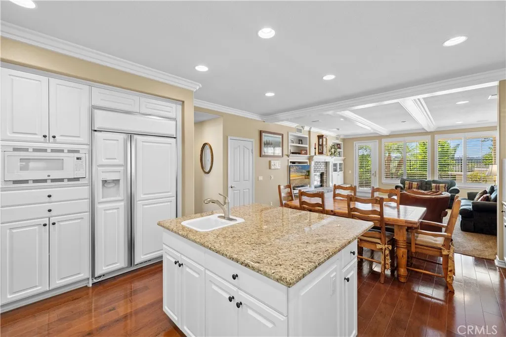 Immaculate Gourmet Kitchen with Center Island opens to a very Spacious Family Room. Immaculate Gourmet Kitchen with Center Island opens to a very Spacious Family Room.