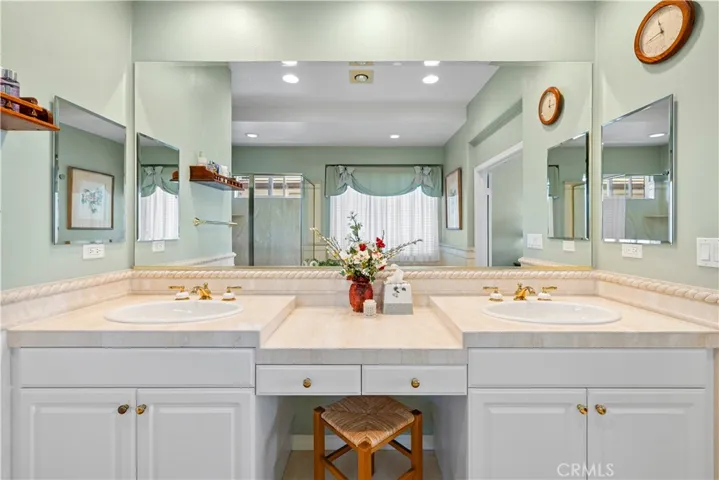 Gorgeous Dual Vanity Area Accented in Beautiful Stone.