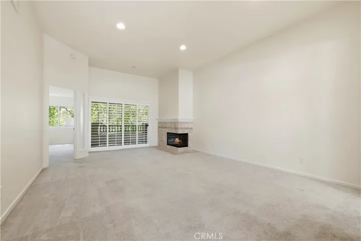 Spacious living room with fireplace.