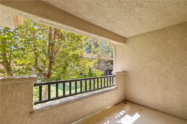 View of greenbelt on back balcony.
