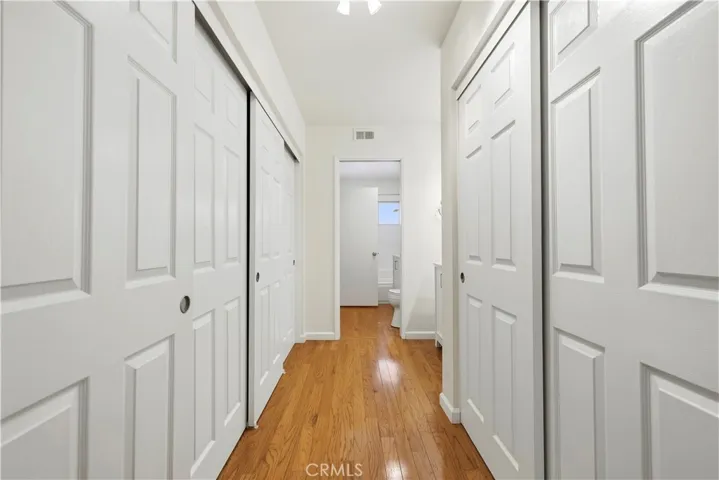 Closet space on both sides with closet organizers
