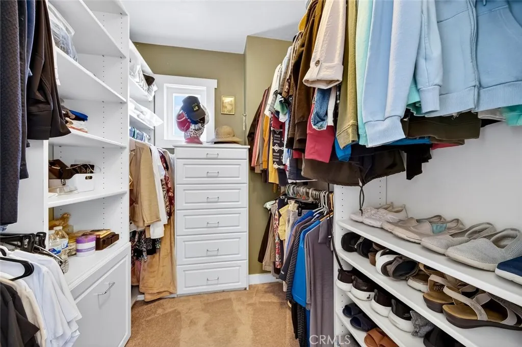 Primary walk in closet. Primary walk in closet.