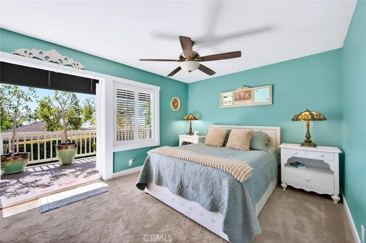 Primary bedroom with an ocean view deck.