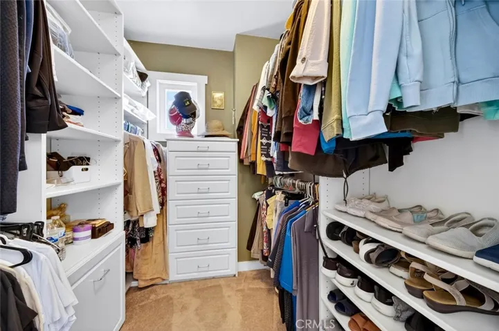 Primary walk in closet.