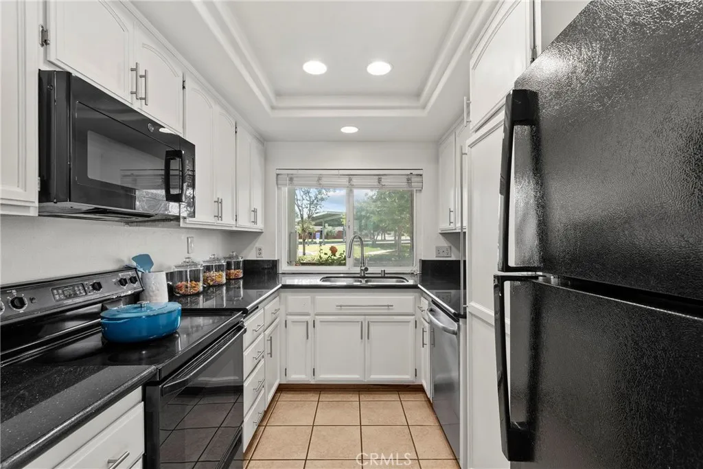 Kitchen includes refrigerator, microwave, stove, dishwasher