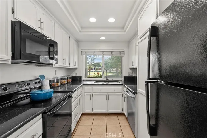 Kitchen includes refrigerator, microwave, stove, dishwasher