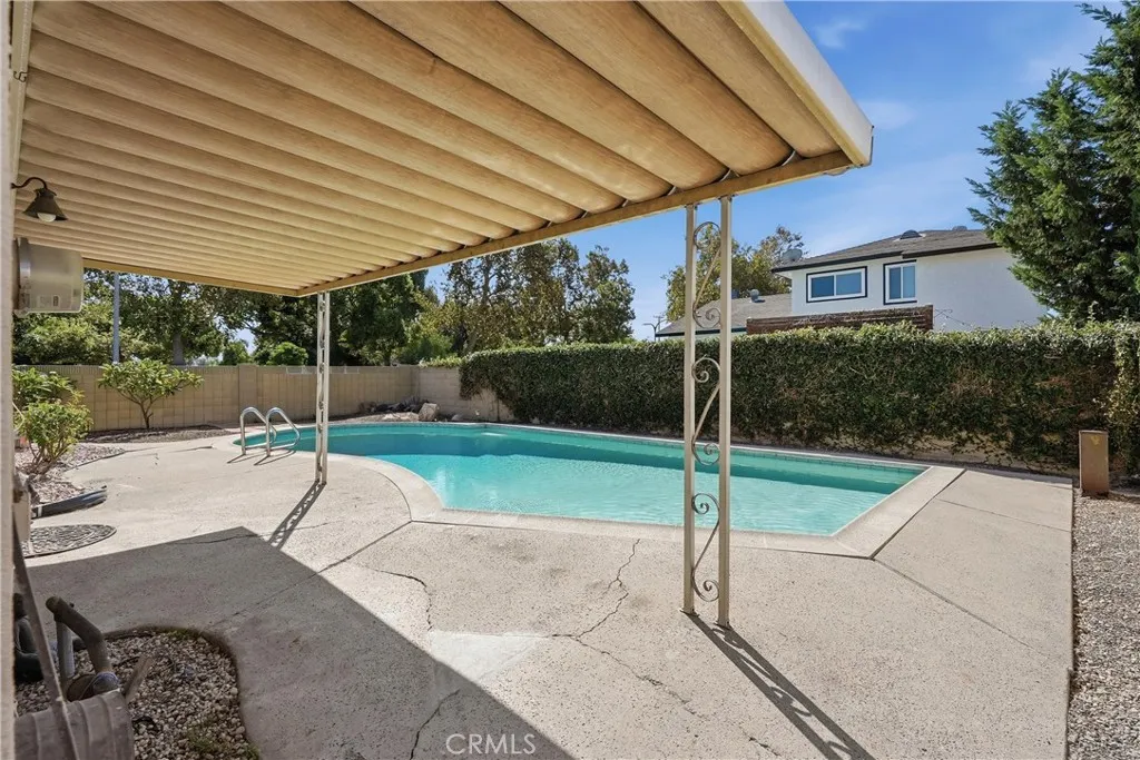 Covered patio that overlooks the pool Covered patio that overlooks the pool