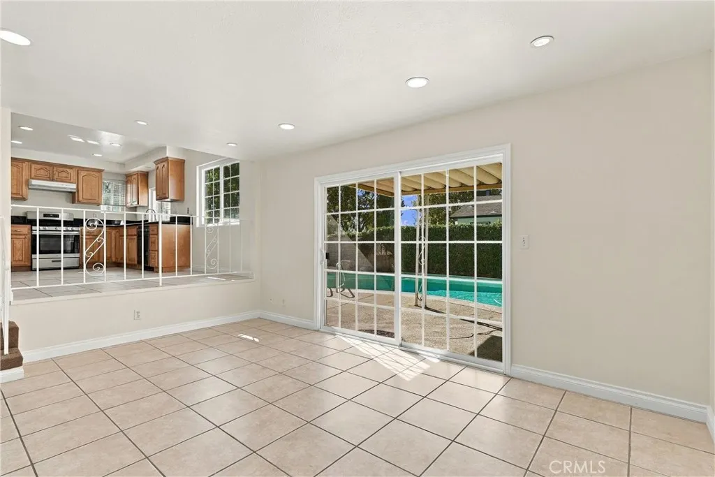 Step down into the family room that over looks the pool Step down into the family room that over looks the pool