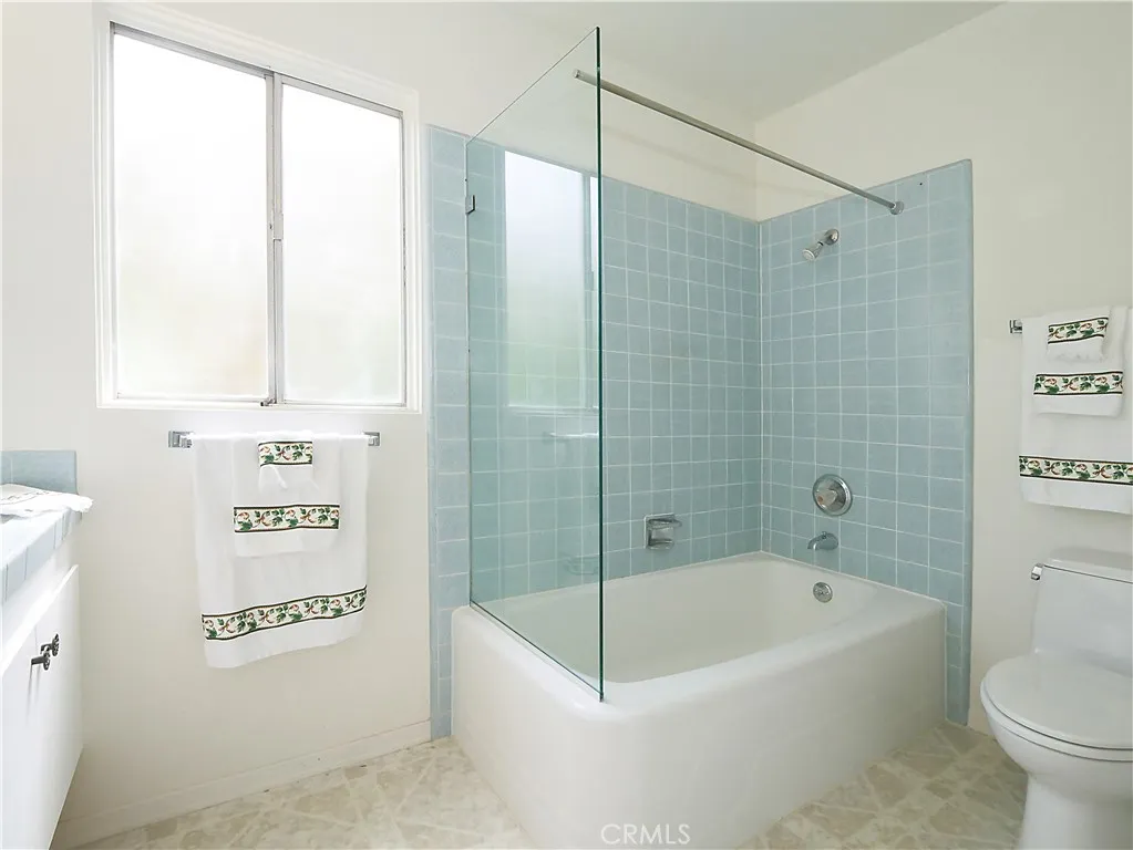 Hall bath features tub and shower Hall bath features tub and shower