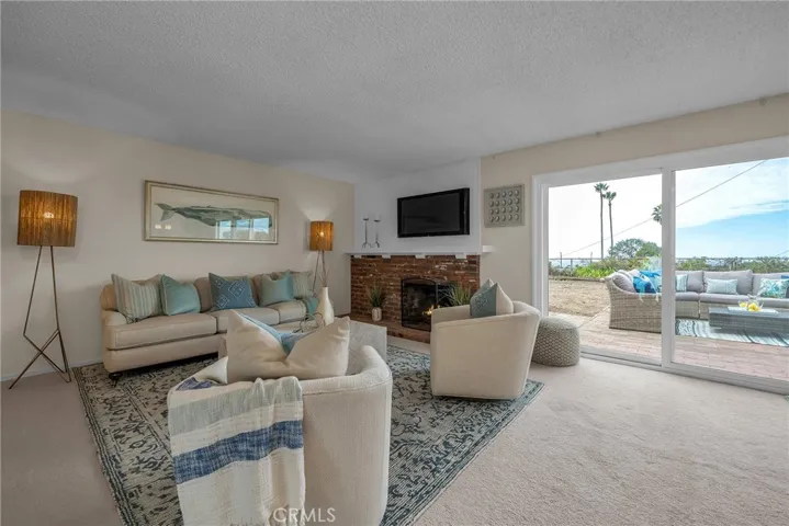 More living space with view to the rear patio and yard