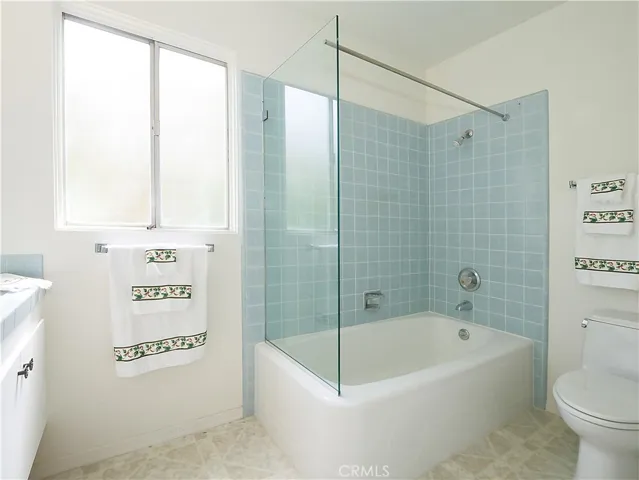 Hall bath features tub and shower