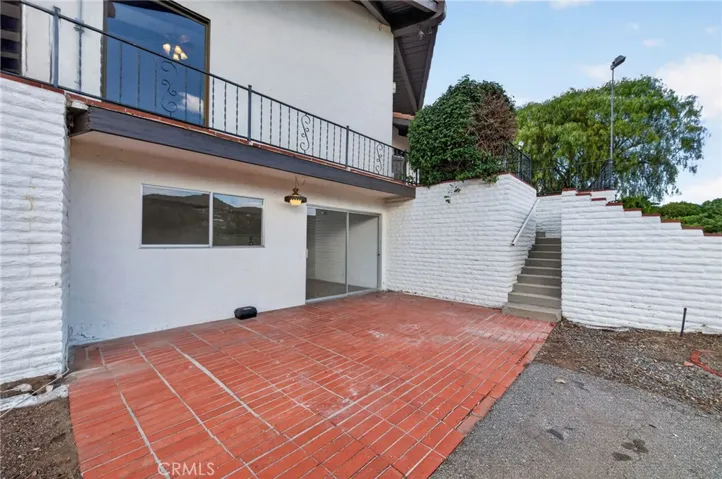 Patio and entry into the basement bonus rooms (additional living space)