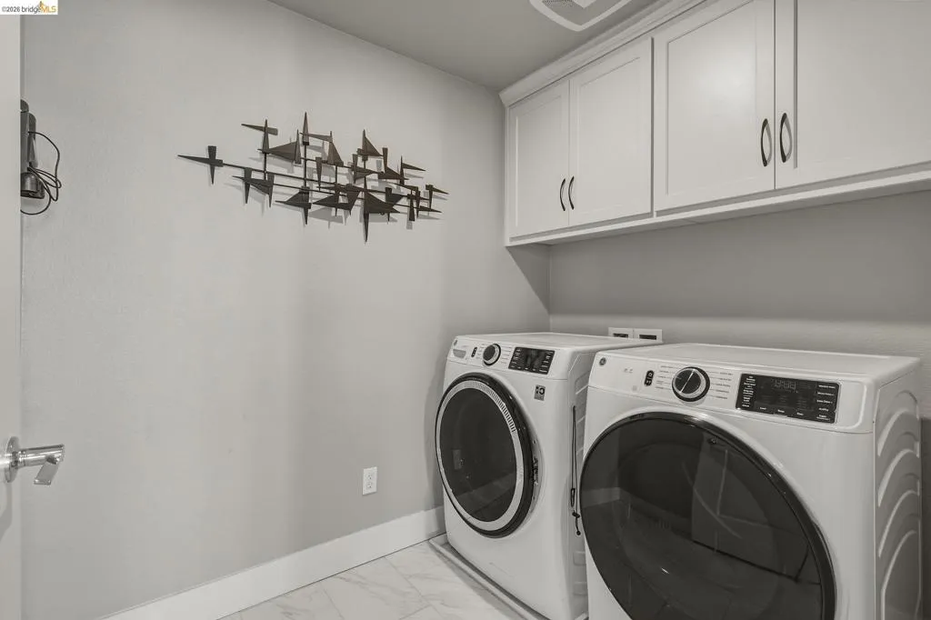 White cabinetry with dark hardware