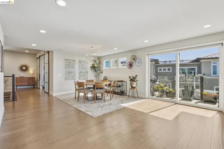 Recessed lighting illuminating wood-finish flooring