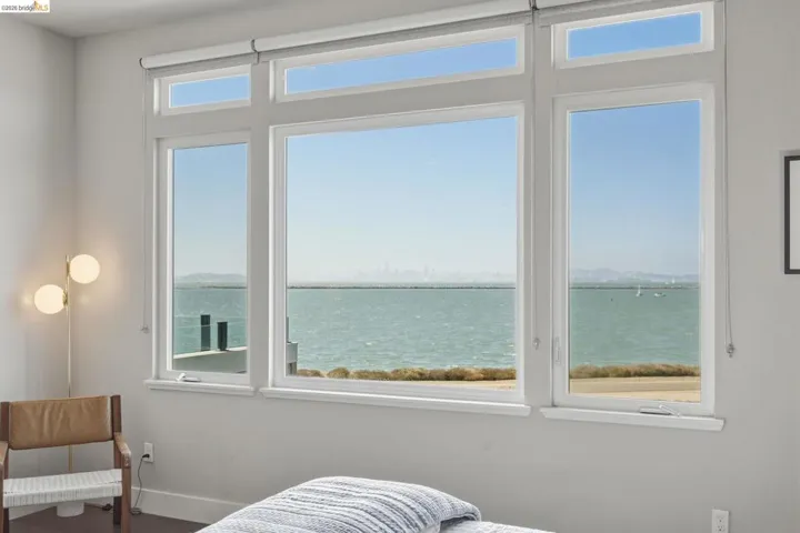Expansive multi-pane window system with waterfront scenery