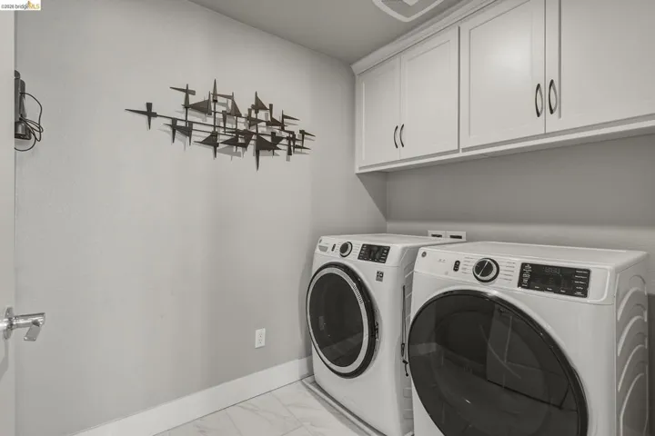 White cabinetry with dark hardware