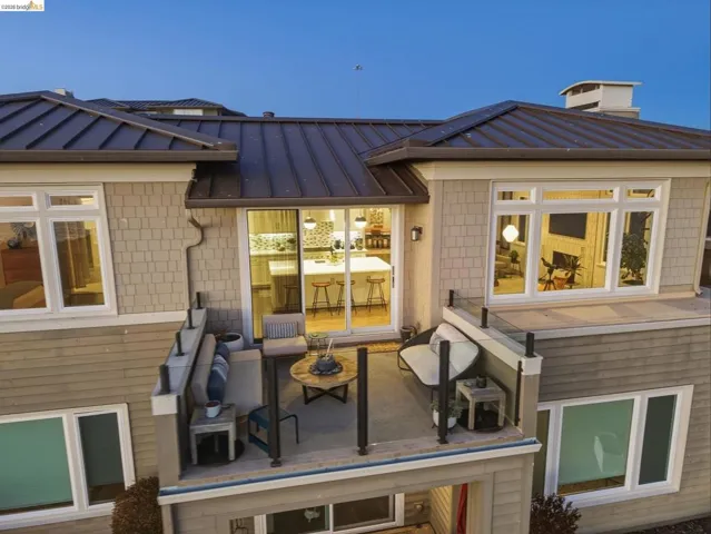 Balcony featuring glass and metal railings, providing outdoor living space