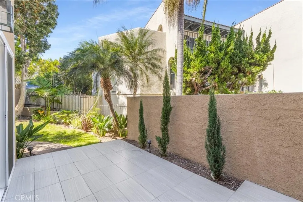 TILED PATIO LEADS TO GRASSY BACKYARD... TILED PATIO LEADS TO GRASSY BACKYARD...